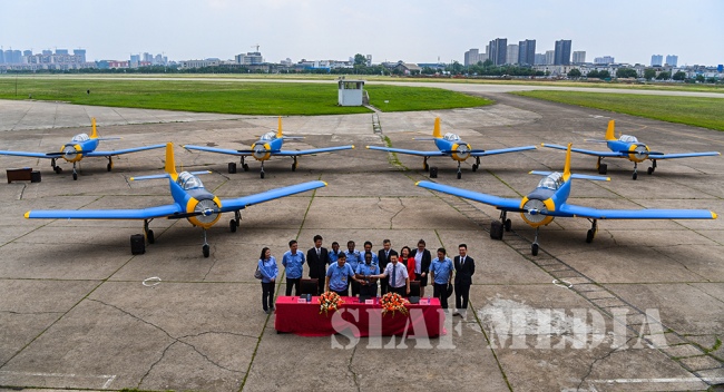 The Commander Accepts Six (6) PT-6 Aircraft from CATIC