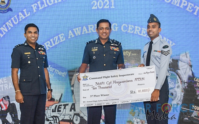 FLIGHT
SAFETY POSTER COMPETITION WINNERS RECEIVE AWARDS FROM THE COMMANDER