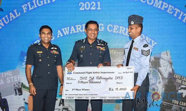 FLIGHT
SAFETY POSTER COMPETITION WINNERS RECEIVE AWARDS FROM THE COMMANDER