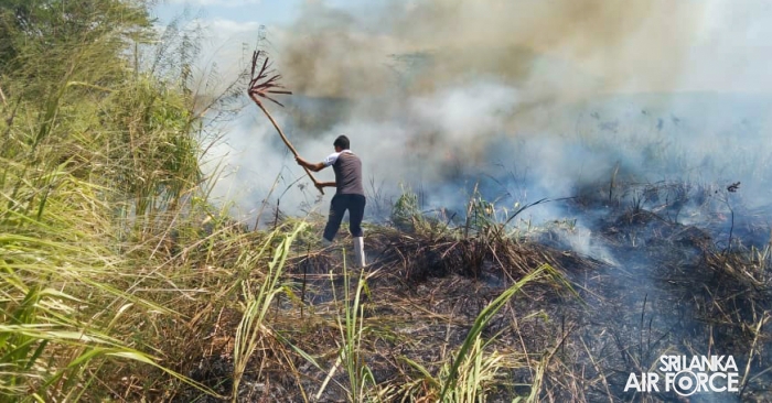 SLAF ASSISTS
IN EXTINGUISHING FOREST FIRE NEAR HAMBANTOTA NEW DISTRICT HOSPITAL