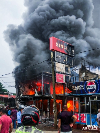 SLAF ASSISTS IN EXTINGUISHING FIRE AT SINGER SHOWROOM IN VAVUNIYA