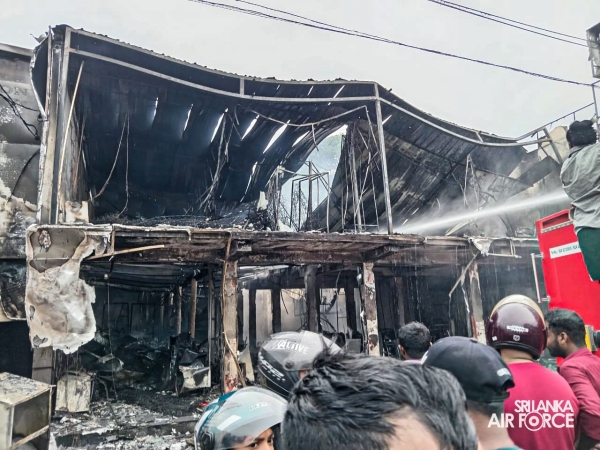 SLAF ASSISTS IN EXTINGUISHING FIRE AT SINGER SHOWROOM IN VAVUNIYA
