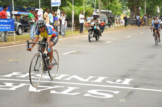 Airman Jeewan Jayasinghe peddles his way to the top at the Maurice Coomerawel Cycle Race