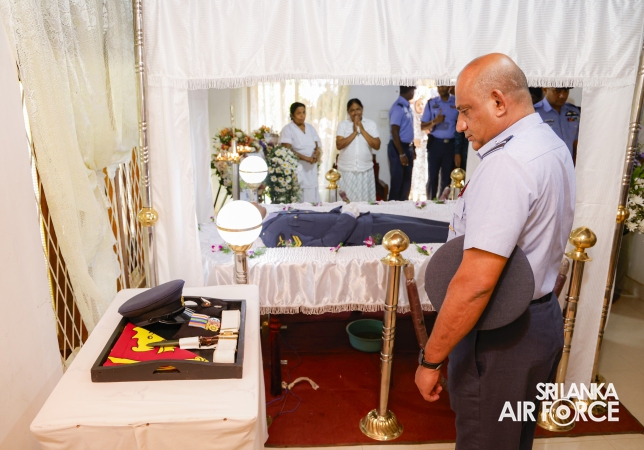 AIR CHIEF
PAYS LAST RESPECTS TO FALLEN SERVICEMEN